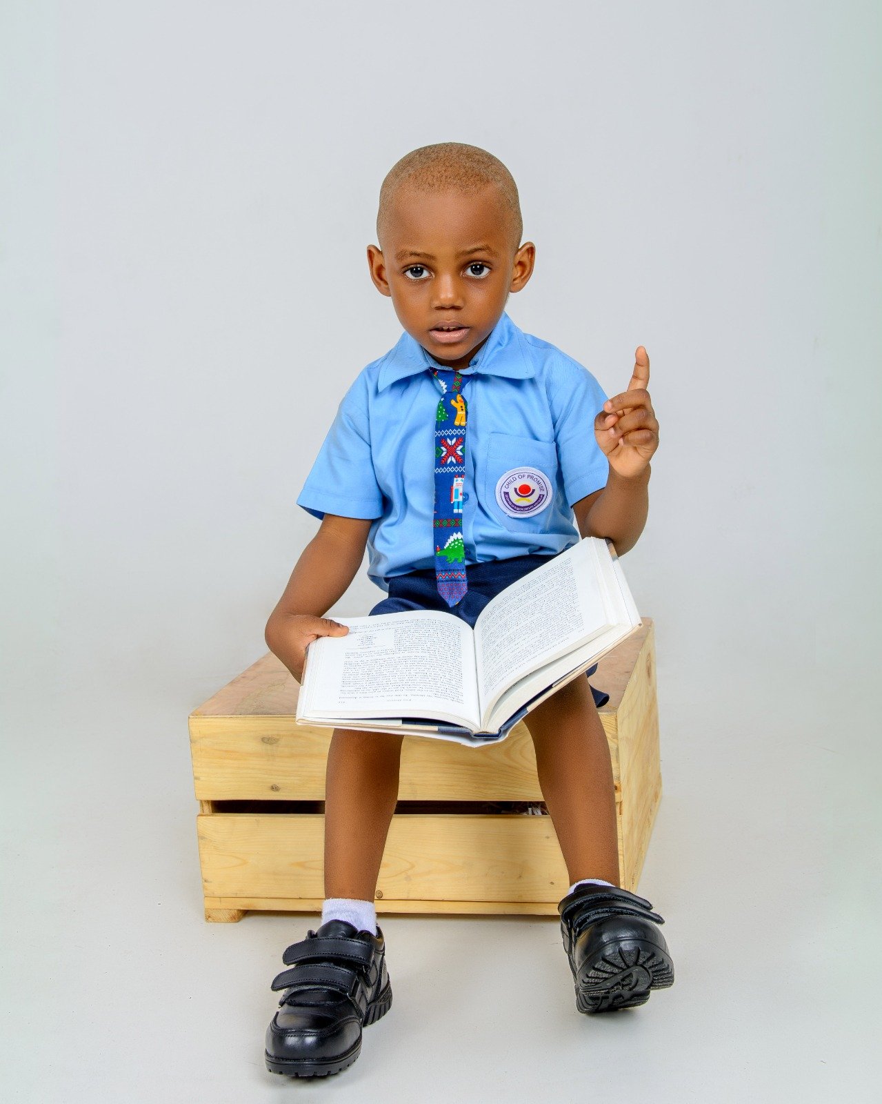 Boy reading while wearing Hammond school shoes