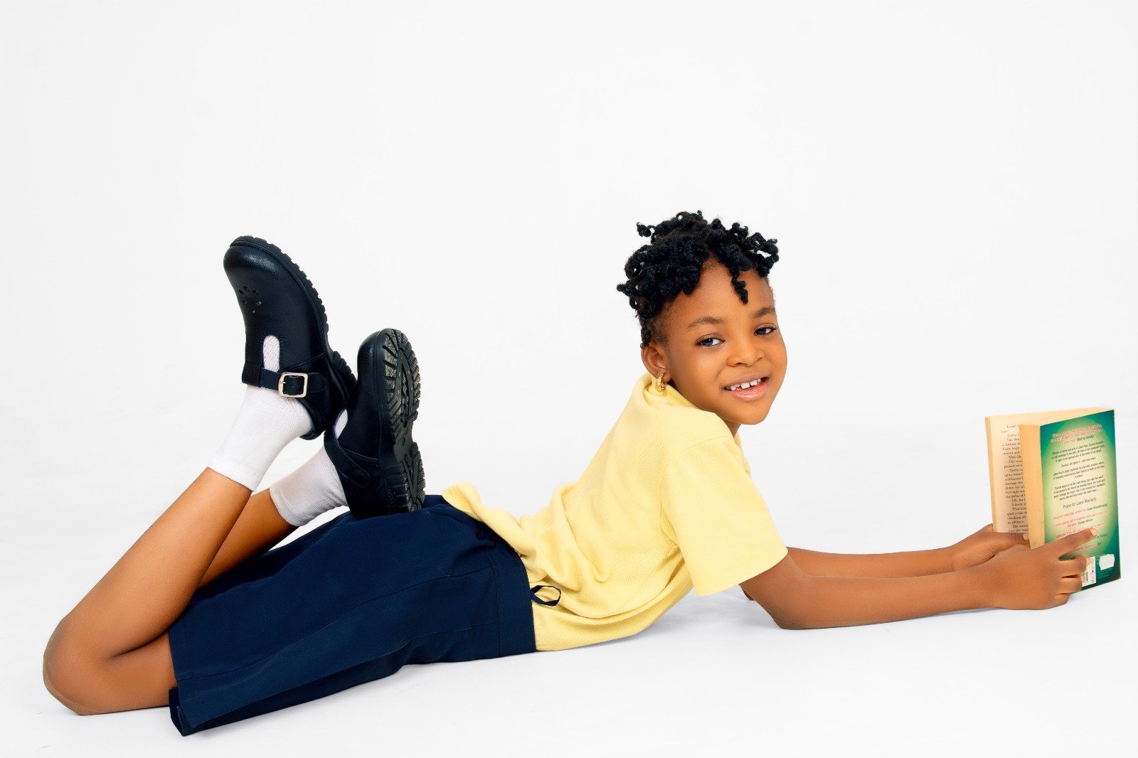 Student reading while wearing Hammond school shoes